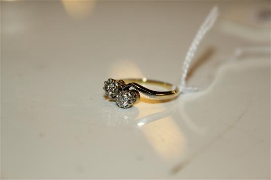 Diamond two-stone crossover ring, in gold setting